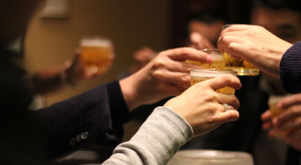 Group of People Raising a Toast